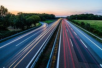 Multi-lane Free Flow Highway The photo shows free flow traffic on a highway